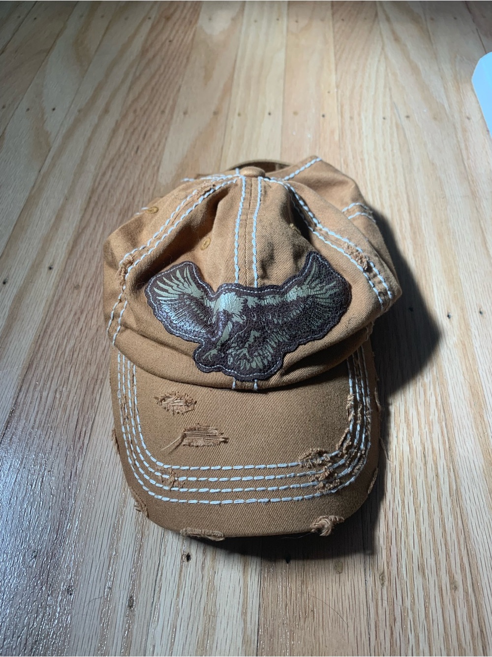 Tan and brown vintage baseball cap with embroidered eagle patch